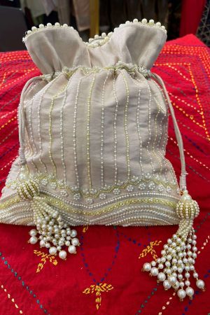 Off White With Pearls And Inner Silk Material Potli prismthestore